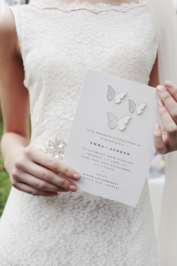Laser cut wedding invitation featuring 3D butterflies.